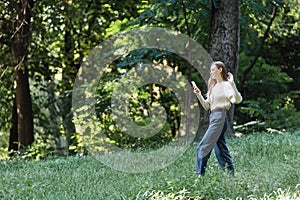 happy young woman waving hand during