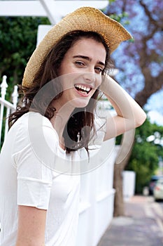 Happy young woman wearing hat