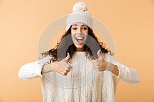 Happy young woman wearing winter clothes