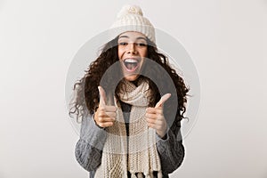 Happy young woman wearing winter clothes