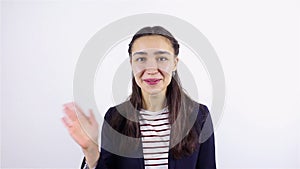 Happy young woman welcomes and smiles. Online video chat on a white background