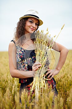 Happy young woman in wheat field