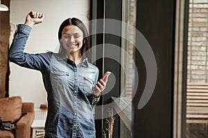 happy young woman in wireless earphones
