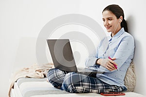 Happy young woman working from home