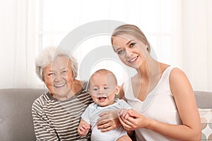 Happy young woman with her child and grandmother