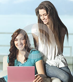 Happy young women with netbook