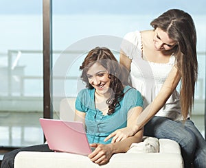 Happy young women with netbook