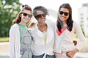 Happy young women in sunglasses outdoors