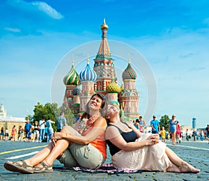 Happy young women visit Red Square