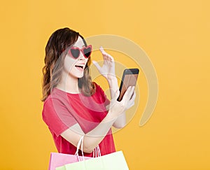 Happy young Women  watching smartphone and shopping