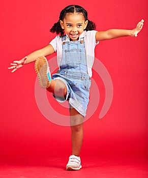 Happy, youth and girl on red background kick legs for happy childhood, positive mindset and smile. Fashion mockup