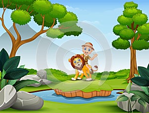 Happy zookeeper boy and lion playing in the nature