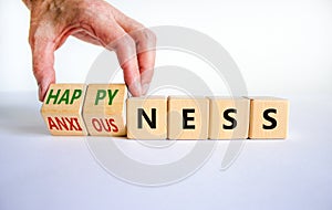 Happyness or anxiousness. Doctor turns cubes and changes the word `anxiousness` to `happyness`. Beautiful white table, white