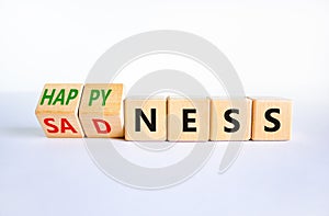 Happyness or sadness symbol. Turned cubes and changed the word `sadness` to `happyness`. Beautiful white background. Business,