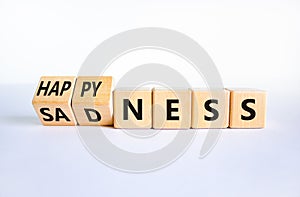Happyness or sadness symbol. Turned cubes and changed the word `sadness` to `happyness`. Beautiful white background. Business,