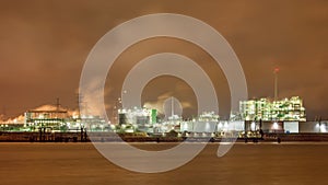 Harbor area with Illuminated petrochemical production plant, Port of Antwerp, Belgium