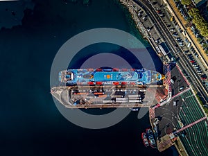 Harbor area and see view from Corsica, big blue ship side docking station as small island