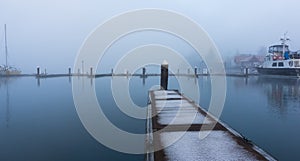 Harbor and boating docks on a misty morning