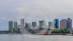 Harbor and buildings of downtown Boston by water, in Boston, USA