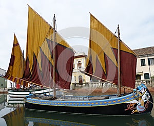 Harbor channel Leonardesque, historic sailboat. Cesenatico. Italy