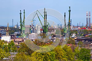 Harbor cranes at the famous shipyard of Gdansk on a sunny day. Poland