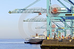 Harbor cranes and transport ship