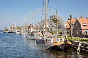 Harbor Dutch city Medemblik with historical wooden sailing ship