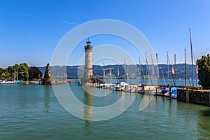 Harbor entrance in Lindau on Lake Constance with the landmark lion and lighthouse, Bavaria, Germany