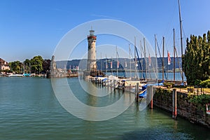 Harbor entrance in Lindau on Lake Constance with the landmark lion and lighthouse, Bavaria, Germany