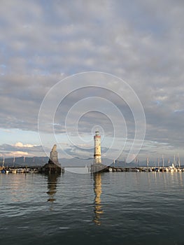 Harbor entrance in Lindau on Lake Constance with the landmark lion and lighthouse, Bavaria, Germany