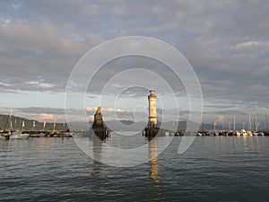 Harbor entrance in Lindau on Lake Constance with the landmark lion and lighthouse, Bavaria, Germany