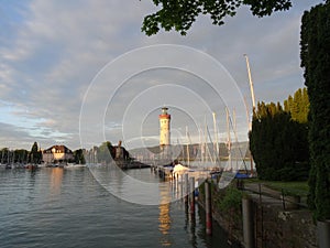 Harbor entrance in Lindau on Lake Constance with the landmark lion and lighthouse, Bavaria, Germany