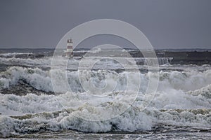 Harbor entry under heavy storm at dusk