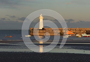 The harbor and lighthouse at Donaghadee in Northern Ireland just before sunset in September