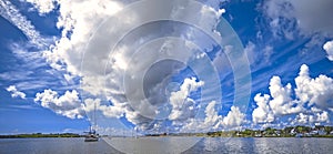 Harbor panorama with village on shore and yachts and boats on water