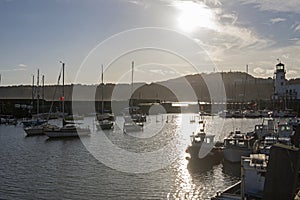 Harbor seafront town with pleasure craft marina at sunset