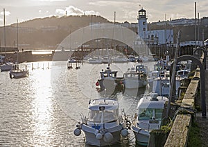 Harbor seafront town with pleasure craft marina at sunset