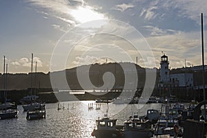 Harbor seafront town with pleasure craft marina at sunset