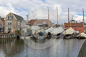 Harbor in Spakenburg with boats on the dock. The village has several harbors