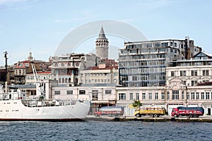 Harbor with trucks by cargo ship