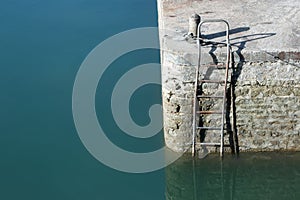 Harbor wall with steel ladder