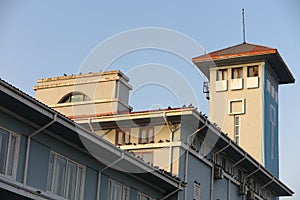 Harbour administrative building with pigeons at sunset photo