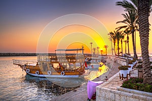 The harbour with boats in Side at sunset