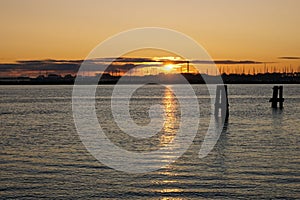 The harbour entrance in WarnemÃ¼nde and the Baltic sea during sunrise