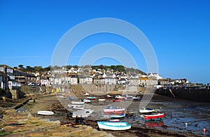 The harbour in the fishing village of Mousehole in Cornwall, England