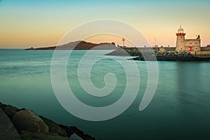 Harbour lighthouse at sunset. Howth. Dublin. Ireland