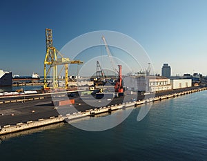 Harbour in Livorno, Italy with cranes and industrial buildings i
