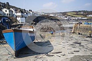 Harbour at low tide with fishing boats