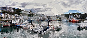 The harbour of Luarca in Asturias Spain on a cloudy day. photo
