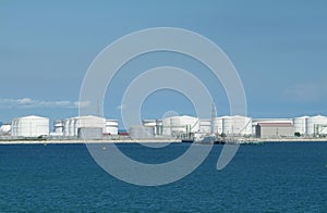 Harbour with oil storage tanks